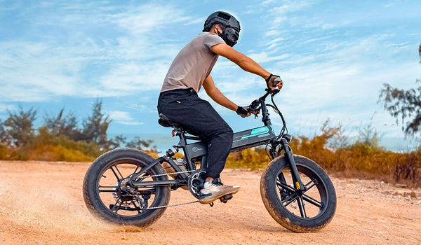 Man rides Fiido M1 Pro Fat Tire Electric Bike on sand