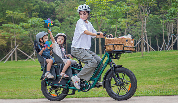 Woman riding fiido t2 electric bike with two children