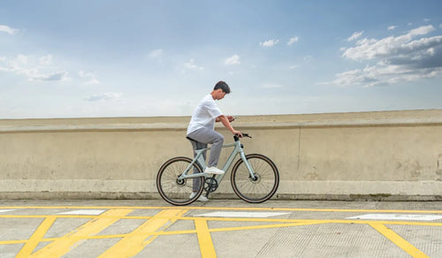 A man rides a Fiido Air electric bicycle