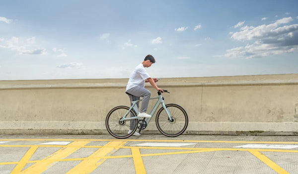 A man rides a Fiido Air electric bicycle