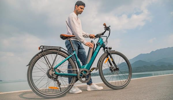 A man disassembles the battery of a Fiido C11 Pro electric bicycle