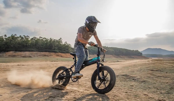 Man rides Fiido M1 Pro Fat Tire Electric Bike on sand