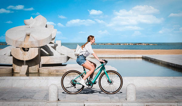 The woman is riding a Fiido C22 eBike.