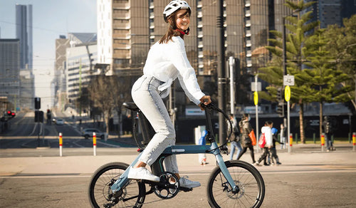 Woman riding a Fiido D12 electric bicycle