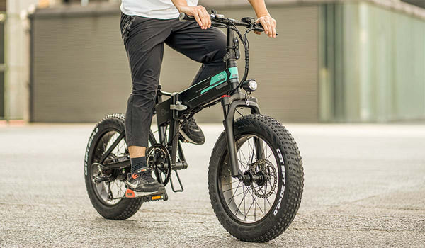 A man rides a Fiido M1 PRO electric bike.