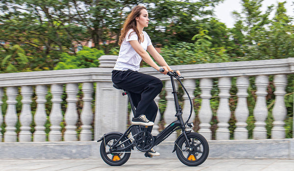 Woman riding M1pro electric bike on bridge