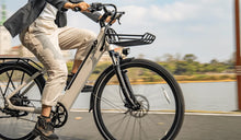 A woman riding a Fiido C11 electric bicycle