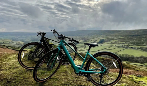 Two electric bikes placed on the slope.