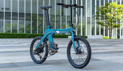 The Fiido X electric bike parked in a modern cityscape.