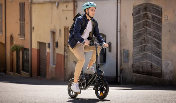 A man is riding a Fiido D3 Pro electric bike in the city.