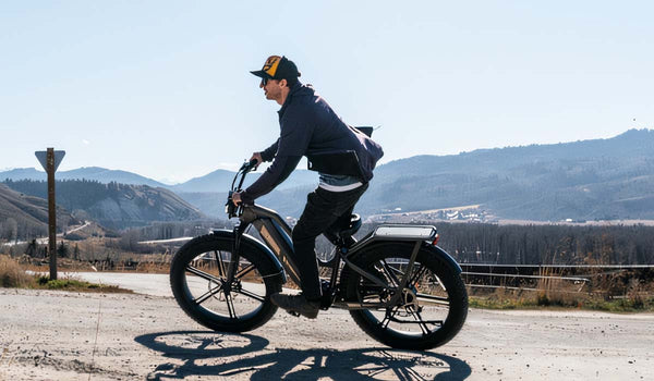 Man rides Fiido Titan ebike on a dirt trail