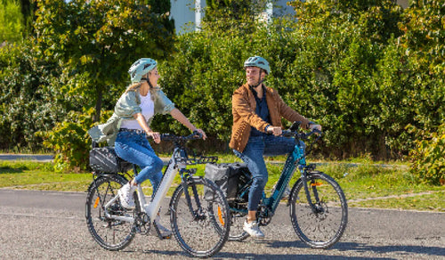 Two people are riding the Fiido C11 lightweight electric bike.