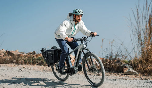 Fiido Nomads Pro touring e-bike with a man riding off-road