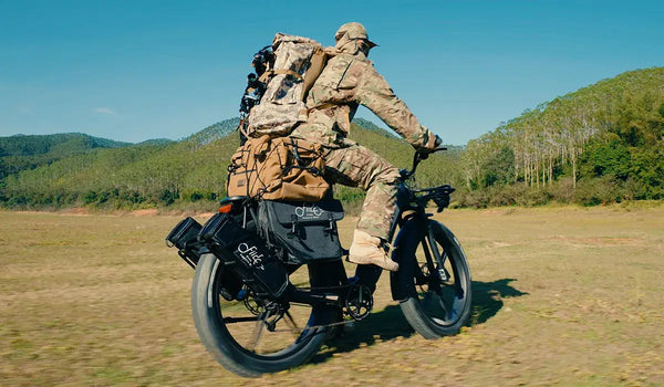 A man prepares to hunt in the wilderness on a Fiido Titan electric bike.