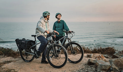 Fiido Nomads Pro e-bike couple riding off-road mountain trail