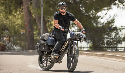 A man rides a Fiido Titan electric bike