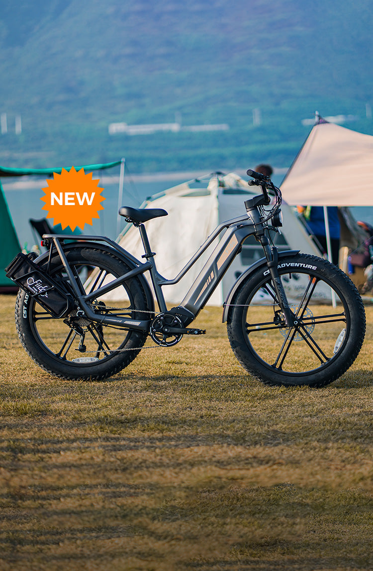 A Fiido Titan electric bike parked next to a tent - m