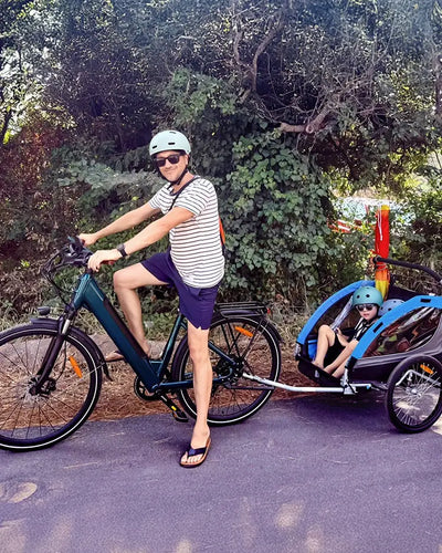 User Christian Wohlgemuth rides a Fiido C11 Pro electric bike, taking a child out for a ride