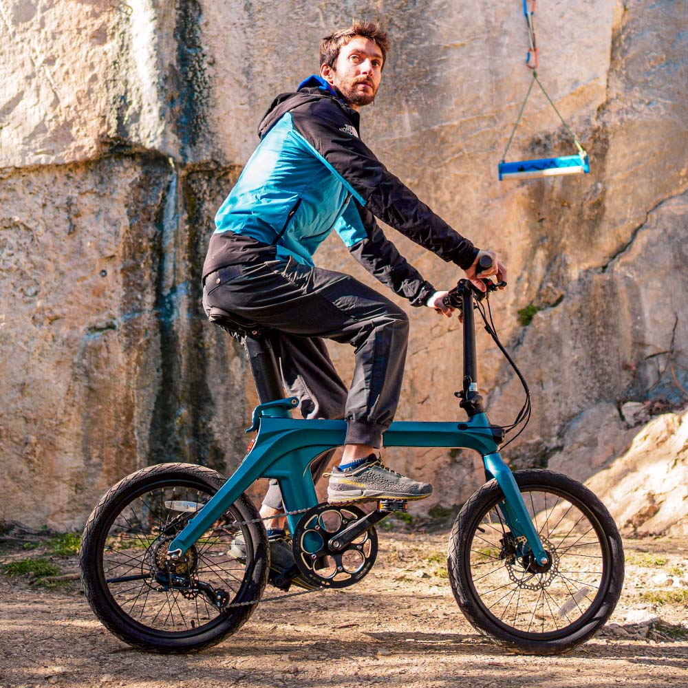 Man riding Fiido X Folding Electric Bike