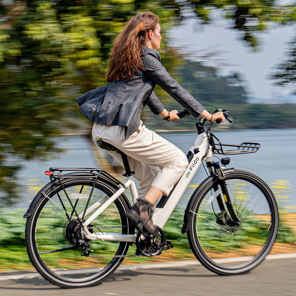 Woman rides Fiido C11 White city E-bike