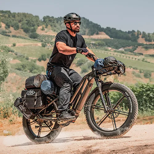 Man riding a Fiido touring e-bike uphill