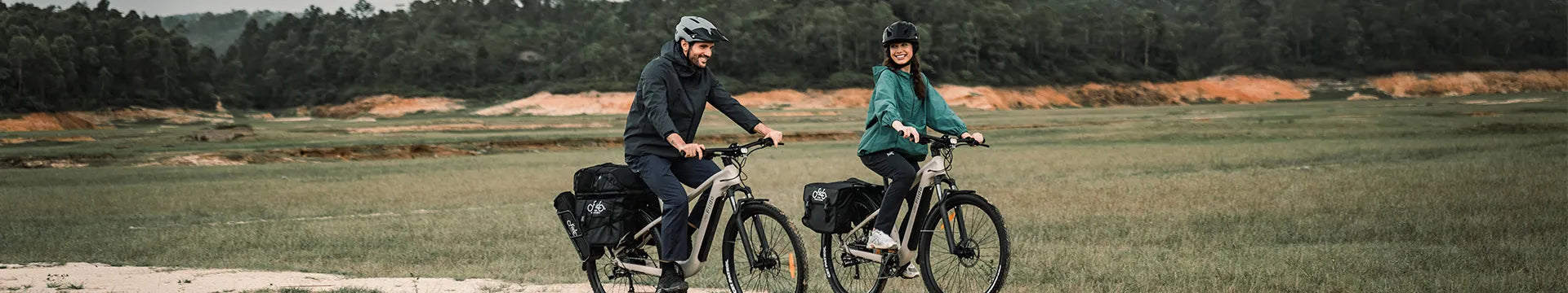 A couple rides a Fiido electric bicycle around town.
