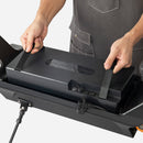 Man removes the battery from Fiido Beast Electric Scooter